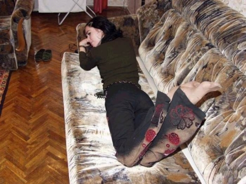Sultry Amateur Poses Seductively on Couch - Explicit Amateur Content