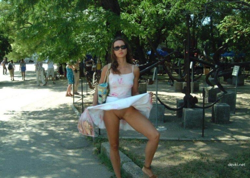 Explicit Amateur Stripper Show: Public Girl Striptease Photo