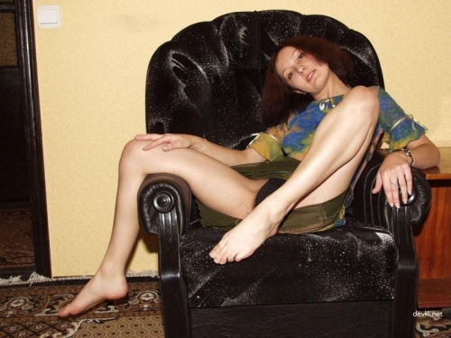 Provocative Amateur Photoshoot: Girl Strips in Chair for Explicit Sensual Pics