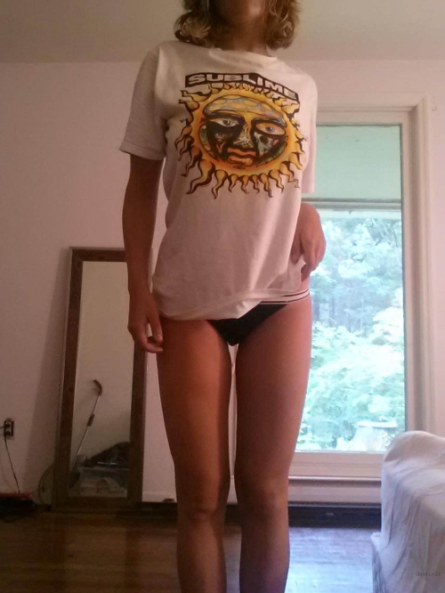 Seductive Young Woman Strips Down, Flaunting Her Alluring Curves