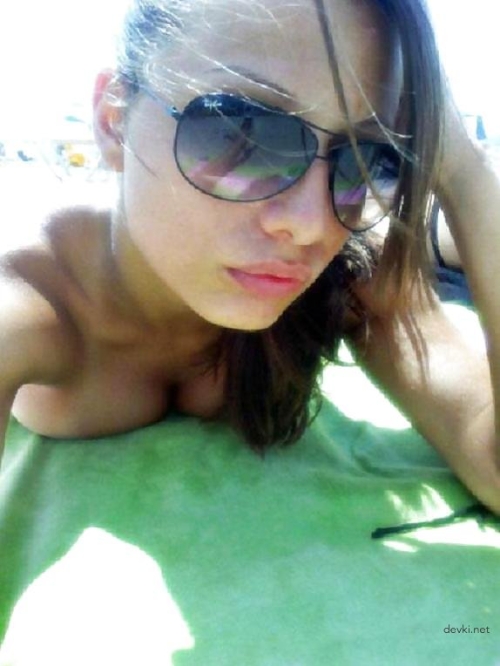 Steamy Beach Babe Sunbathing - Explicit Amateur Girl Tanning Photo