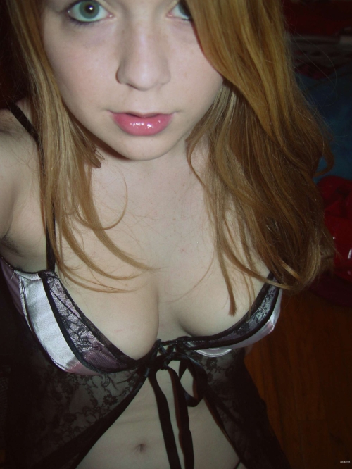 Amateur Girl's Explicit Selfie Obsession: Bold Pose in Racy Photo