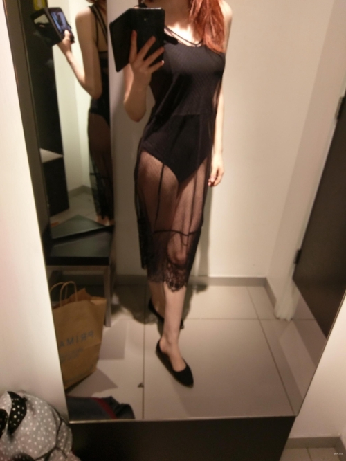 Sultry Redhead in Sheer Lingerie Teasing with Curves