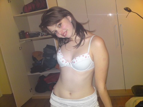 Seductive Close-up: Petite Girl Embracing Her Tiny Breasts - Explicit Amateur Photo