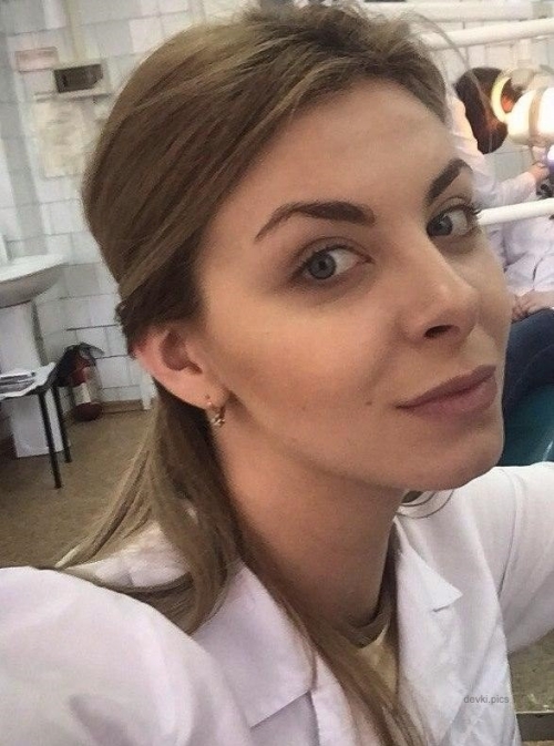 XXX Naughty Nurse Selfie: Seductive Amateur Photo with Explicit Pose