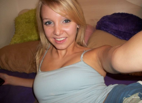 Hot Blonde Undresses on Bed - Explicit Amateur Nude Photo