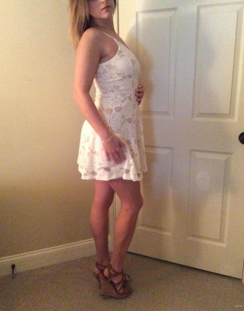 Sultry Amateur Babe Shows Off Her Curves: Explicit Dress Photo