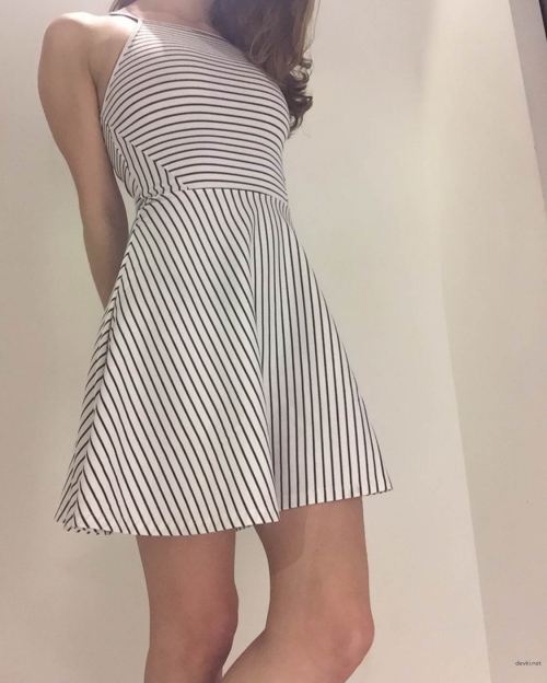 Explicit Upskirt Photo: Amateur Girl Lifts Dress, No Panties - Bold and Uncensored