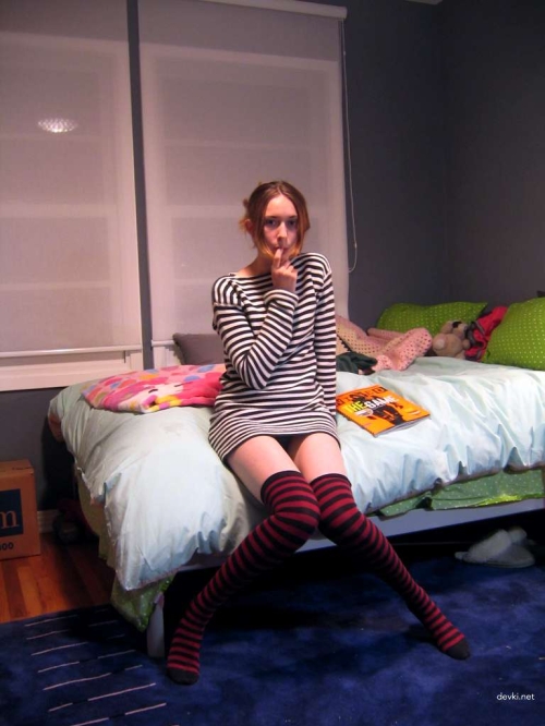 Explicit Amateur Photo: Nude in Striped Stockings & Handcuffs - XXX Adult Content